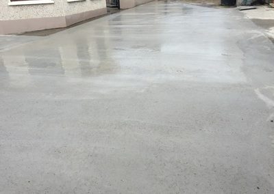 Concrete driveway in front of house